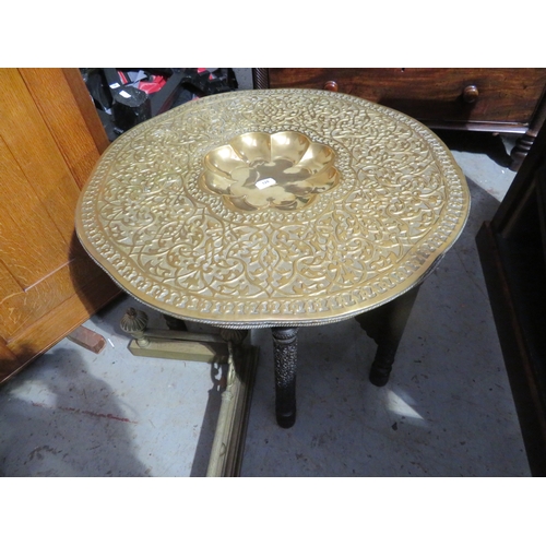 128 - Indian brass tray table with two trays to top an a well carved base