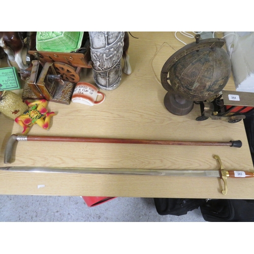 263 - Tynwald Millennium sword, by Wilkinson sword, plus a walking stick with a silver collar