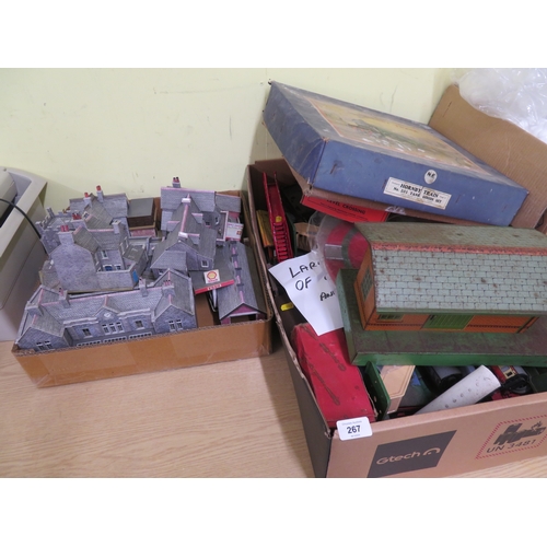 267 - Two boxes of model rail track, carriages, houses, locomotives etc