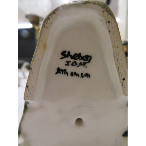 208 - Three Shebeg figures - Sheep shearer, sheep dog and white Manx cat