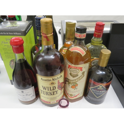 215 - Eight bottles of whisky, rum and cocktail mixers