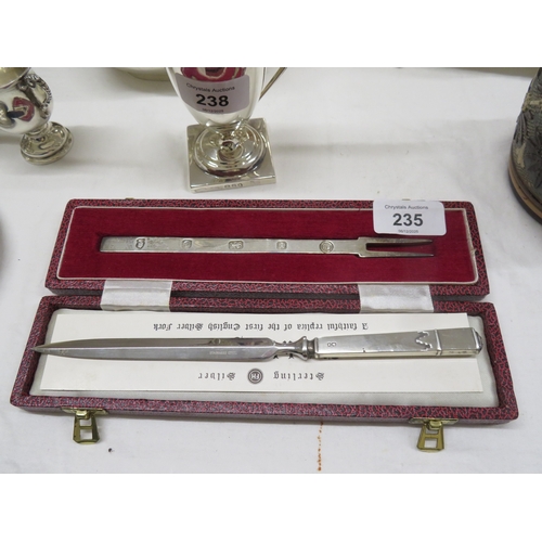 235 - A silver pickle fork cased together with a silver handled paper knife