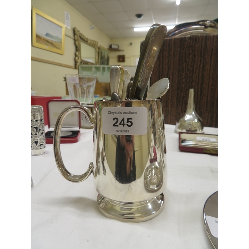 245 - A collection of silver spoons and silver handled items in a silver plated tankard