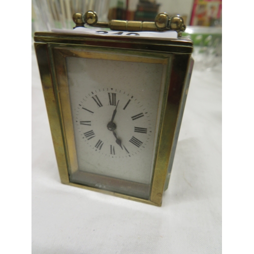 249 - A small French brass and glass carriage clock