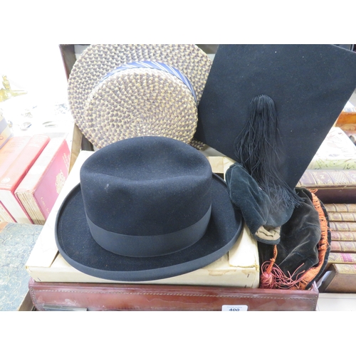 400 - A suitcase containing caps, mortar board, boater and the Kings Way hat