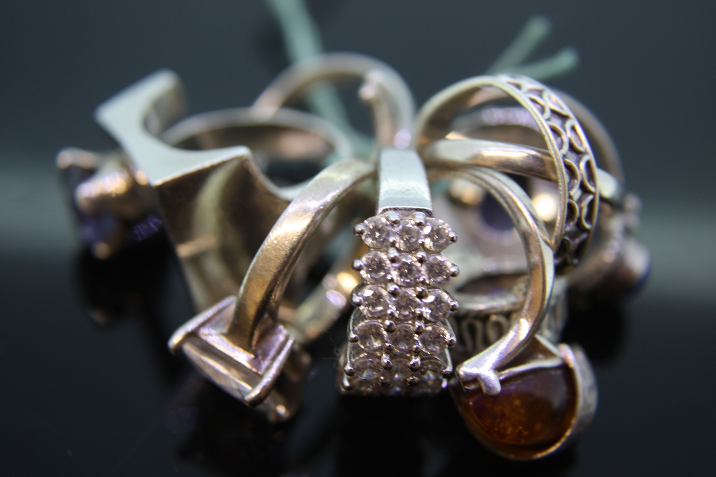 Eight silver jewelled rings
