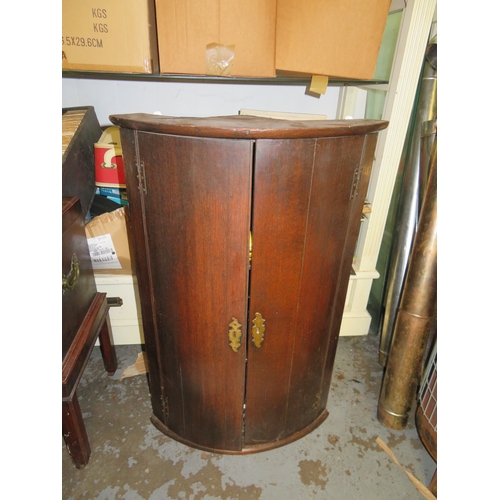 246 - George III bow front mahogany wall hanging corner cabinet