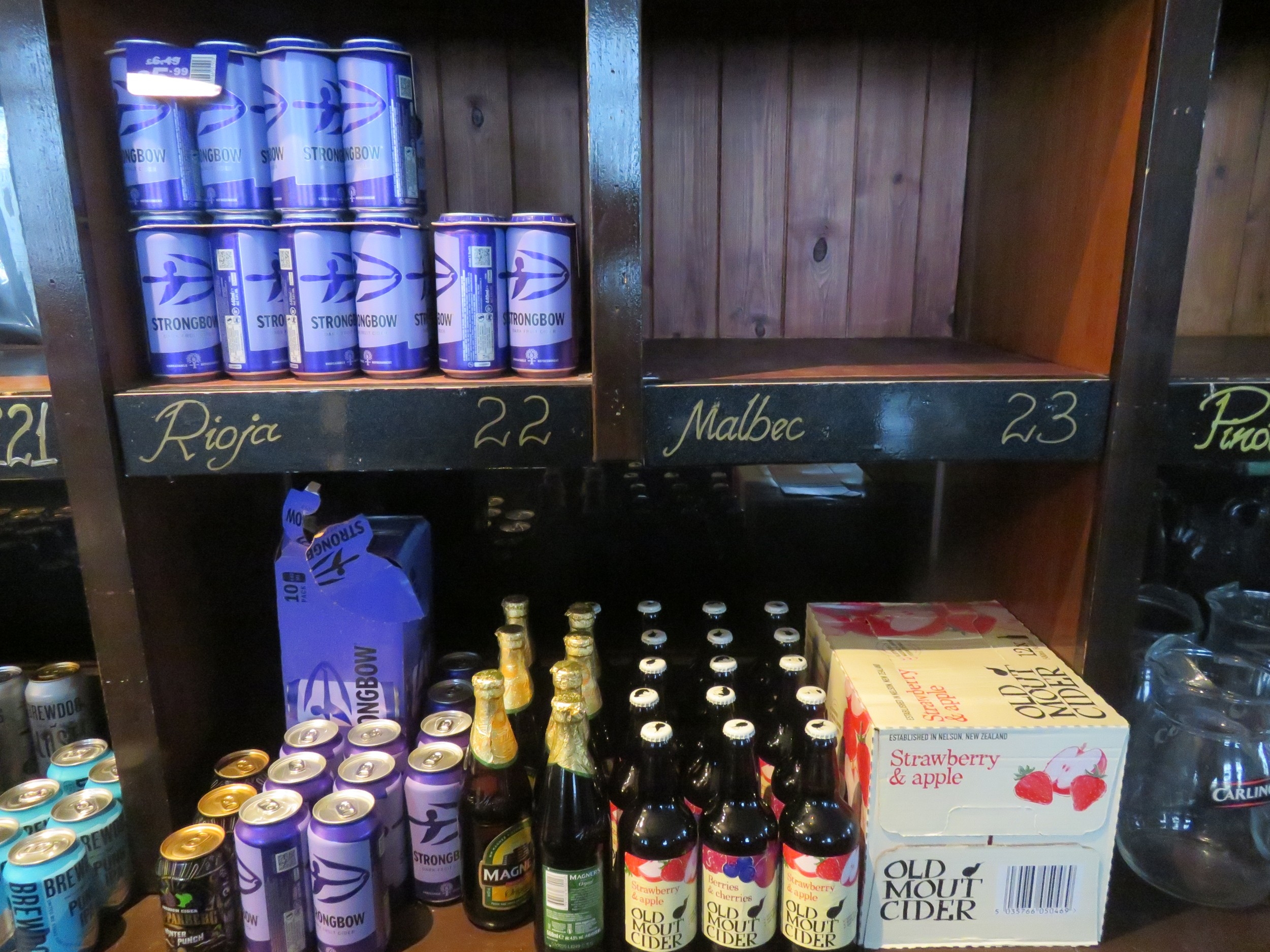 Large collection of tins and bottles of cider