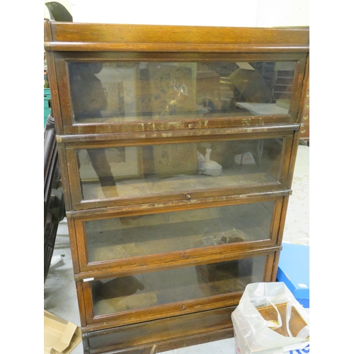 290 - Sectionalised bookcase with glazed sliding doors to front