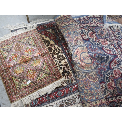 293 - Three silk wool mix rugs plus a blue wool rug&nbsp;
