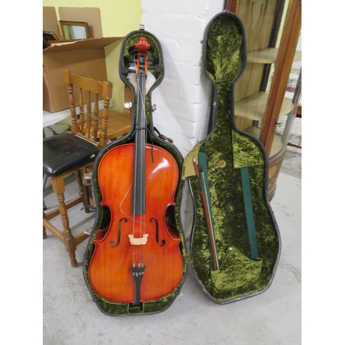 194 - Student's cello in armadillo case, together with bow
