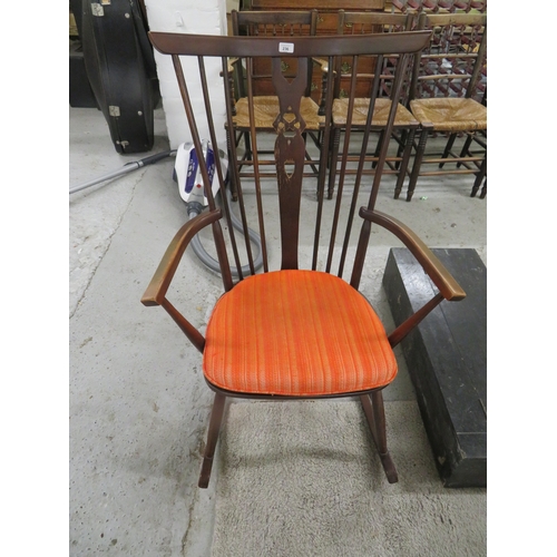 236 - Wooden rocking chair with bright orange cushion
