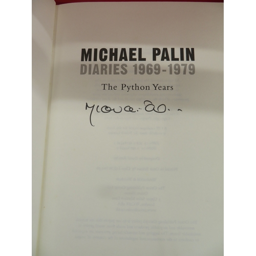 302 - Two Michael Palin hardback books with dust covers, both signed
