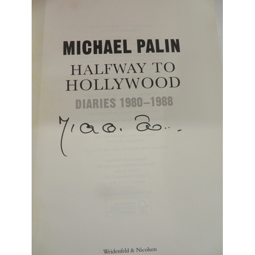 302 - Two Michael Palin hardback books with dust covers, both signed