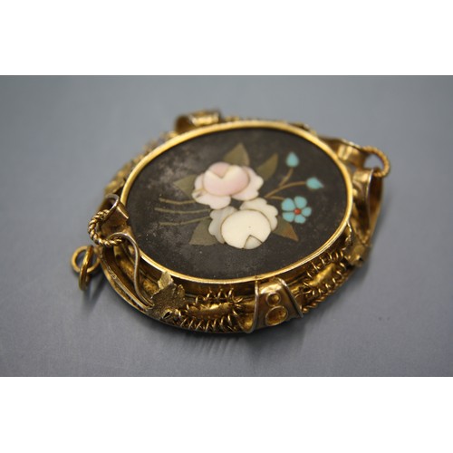 314 - Silver gilt mourning locket with plaited hair and Petra Dura decoration to reverse