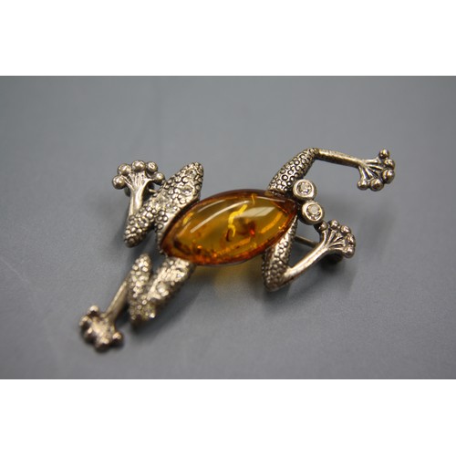 318 - Silver and amber frog brooch