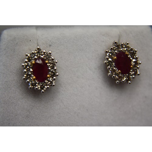 326 - Pair of 9ct gold oval ruby and diamond cluster earstuds
