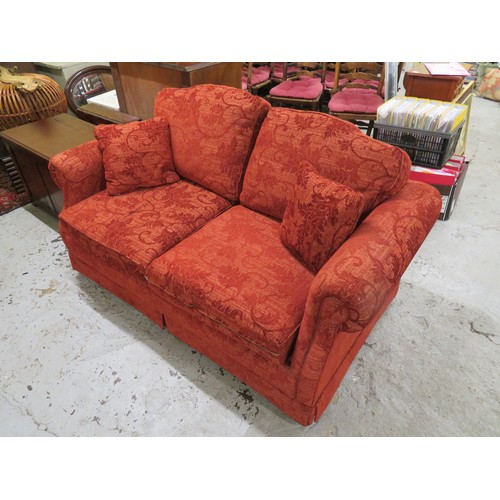 357 - Red floral upholstered two seater sofa bed