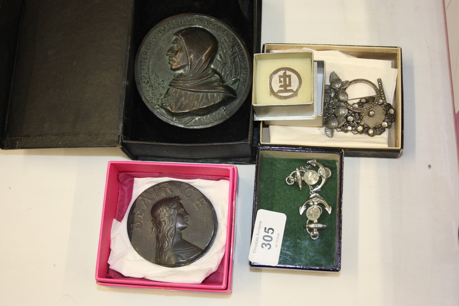 A collection of costume jewellery and bronze style medallions