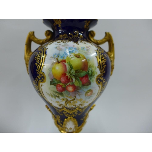 109 - A pair of Royal Worcester vases with gilt twin handles and hand painted fruit panels, signed Hawkins... 