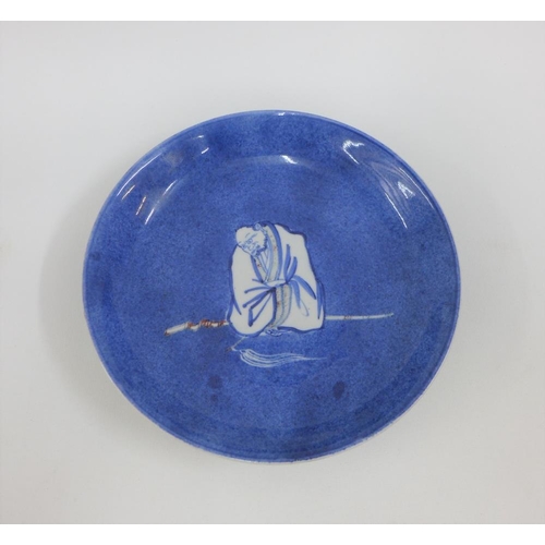 111 - Chinese porcelain shallow dish, the blue ground painted with a figure to the centre,( fritting to un... 