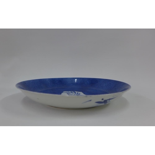 111 - Chinese porcelain shallow dish, the blue ground painted with a figure to the centre,( fritting to un... 