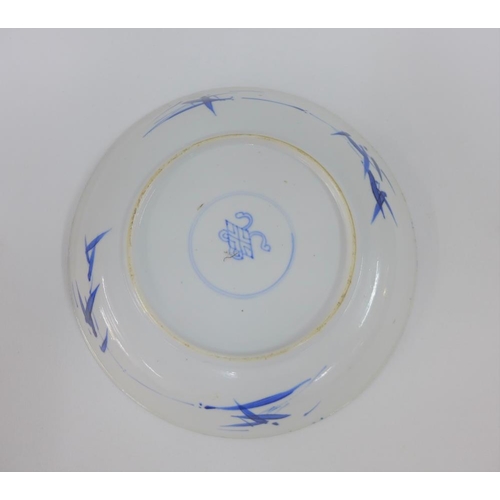 111 - Chinese porcelain shallow dish, the blue ground painted with a figure to the centre,( fritting to un... 