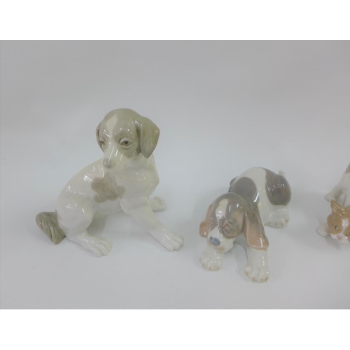 116 - Collection of two Lladro dogs, Lladro cat and a Nao dog figure tallest 15cm (4)