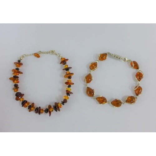 27 - Two silver and amber bracelets (2)