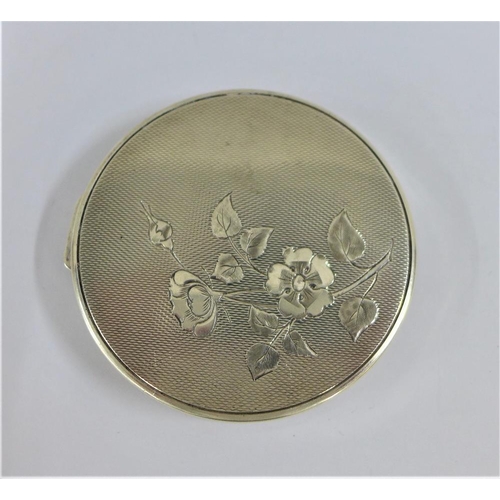 34 - Silver compact with rose pattern to the hinged lid, Birmingham 1962