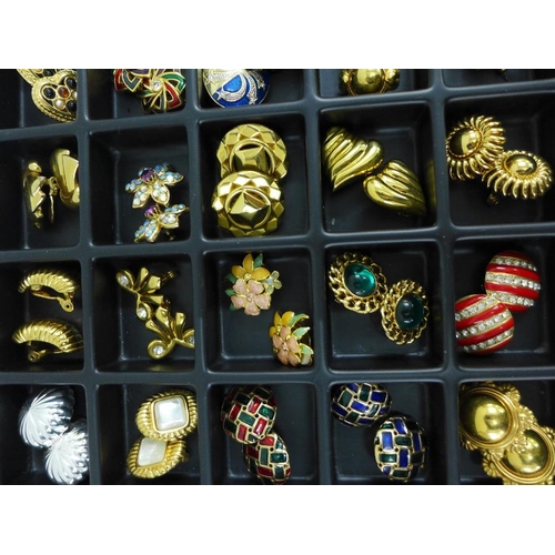 47 - A large quantity of costume jewellery to include necklaces, brooches and clip on earrings, etc conta... 