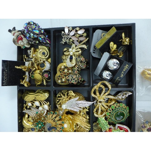 47 - A large quantity of costume jewellery to include necklaces, brooches and clip on earrings, etc conta... 
