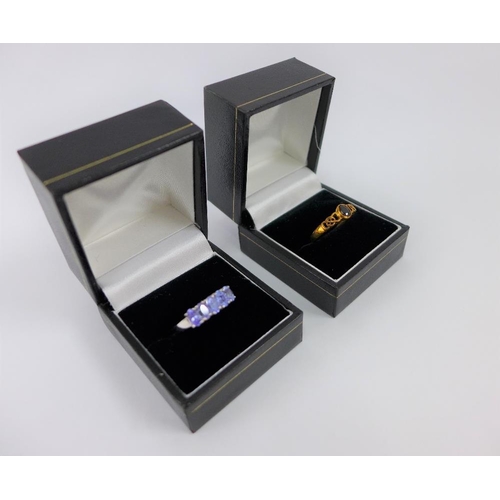 60 - 9 carat white gold tanzanite dress ring together with a 9 carat gold spinel dress ring (2)