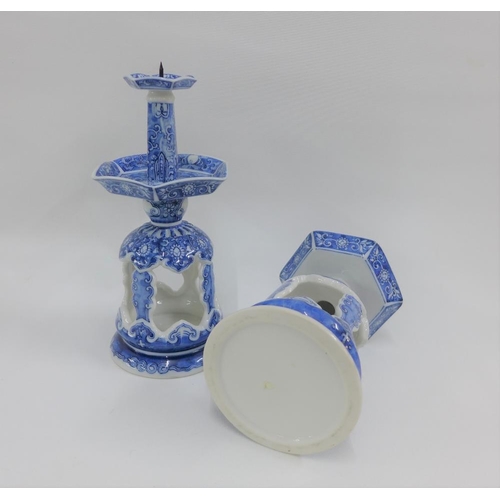 66 - Pair of Chinese blue and white candlesticks, 23cm high