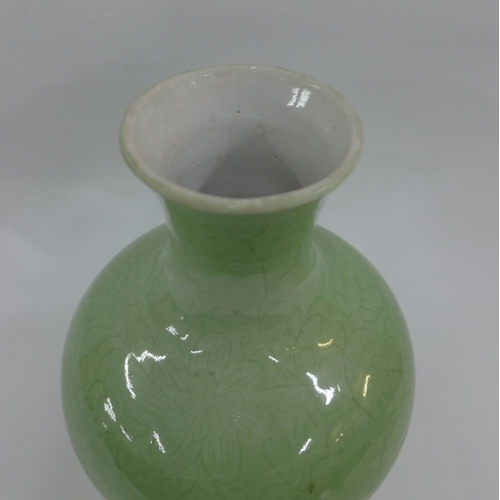 67 - Chinese celadon glazed baluster vase with incised floral pattern, 25cm high