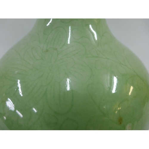 67 - Chinese celadon glazed baluster vase with incised floral pattern, 25cm high