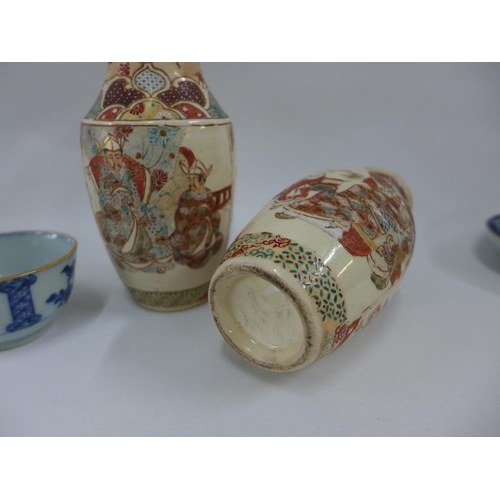 69 - Pair of Japanese earthenware Satsuma vases, 15cm high, and a pair of Chinese blue and white tea bowl... 