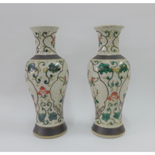 74 - Pair of Chinese high shouldered baluster vases with bird and branch pattern to a craquelure ground a... 