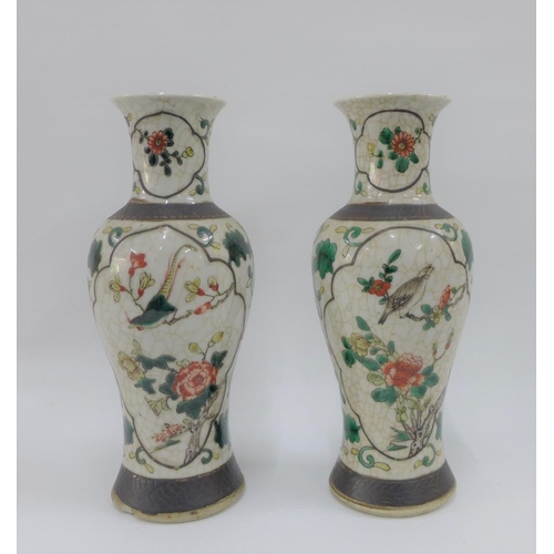 74 - Pair of Chinese high shouldered baluster vases with bird and branch pattern to a craquelure ground a... 