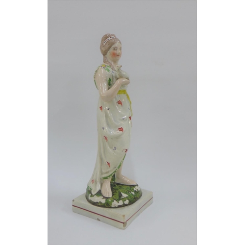 79 - Late 18th / early 19th century Staffordshire pearlware figure of Venus, modelled standing holding a ... 