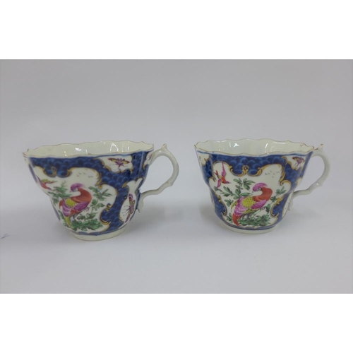 80 - Pair of Dr Wall Worcester cups and saucers, in exotic bird pattern to a blue scale ground, one sauce... 