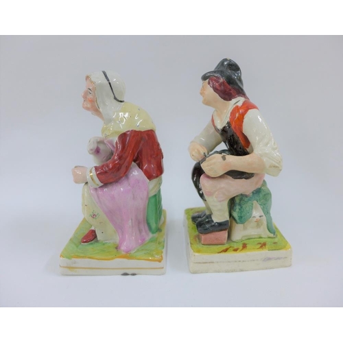 81 - A pair of Staffordshire figures cobbler Jobson and his wife Nell, on square gilt lined bases, 17cm h... 