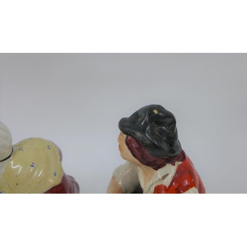 81 - A pair of Staffordshire figures cobbler Jobson and his wife Nell, on square gilt lined bases, 17cm h... 