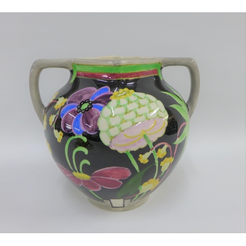 100 - Bough Scottish pottery twin handled vase hand painted with stylised flowers to a black ground, numbe... 