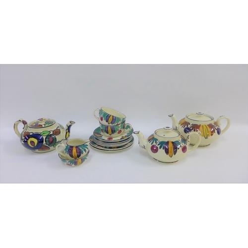 106 - Scottish handpainted pottery table wares to include teapots, cups and saucers, etc (13)