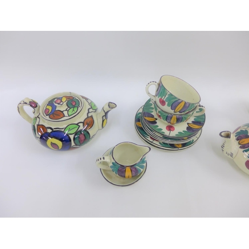 106 - Scottish handpainted pottery table wares to include teapots, cups and saucers, etc (13)