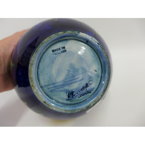 68 - Moorcroft bowl the blue ground tubeline decorated with fruit, with facsimile signature to the base a... 