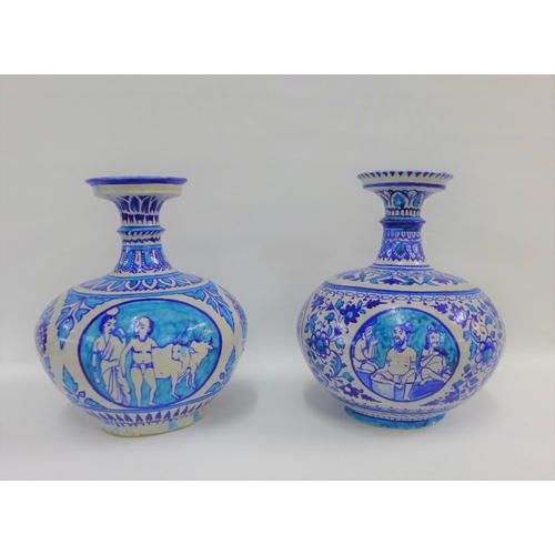 81 - A pair of Middle Eastern style bottle neck vases, painted with flowers and figures to a turquoise gr... 