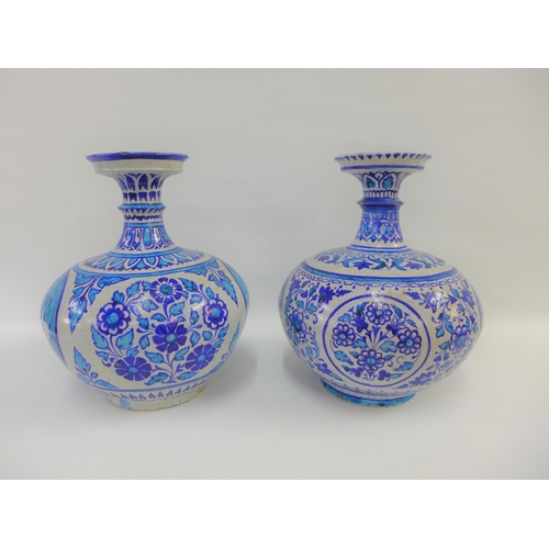 81 - A pair of Middle Eastern style bottle neck vases, painted with flowers and figures to a turquoise gr... 