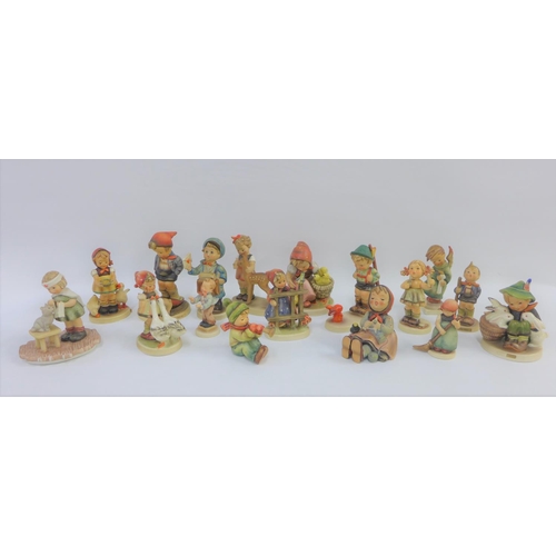 82 - Collection of seventeen various Hummel and Goebel figures to include Little Hiker and Farm Boy etc, ... 